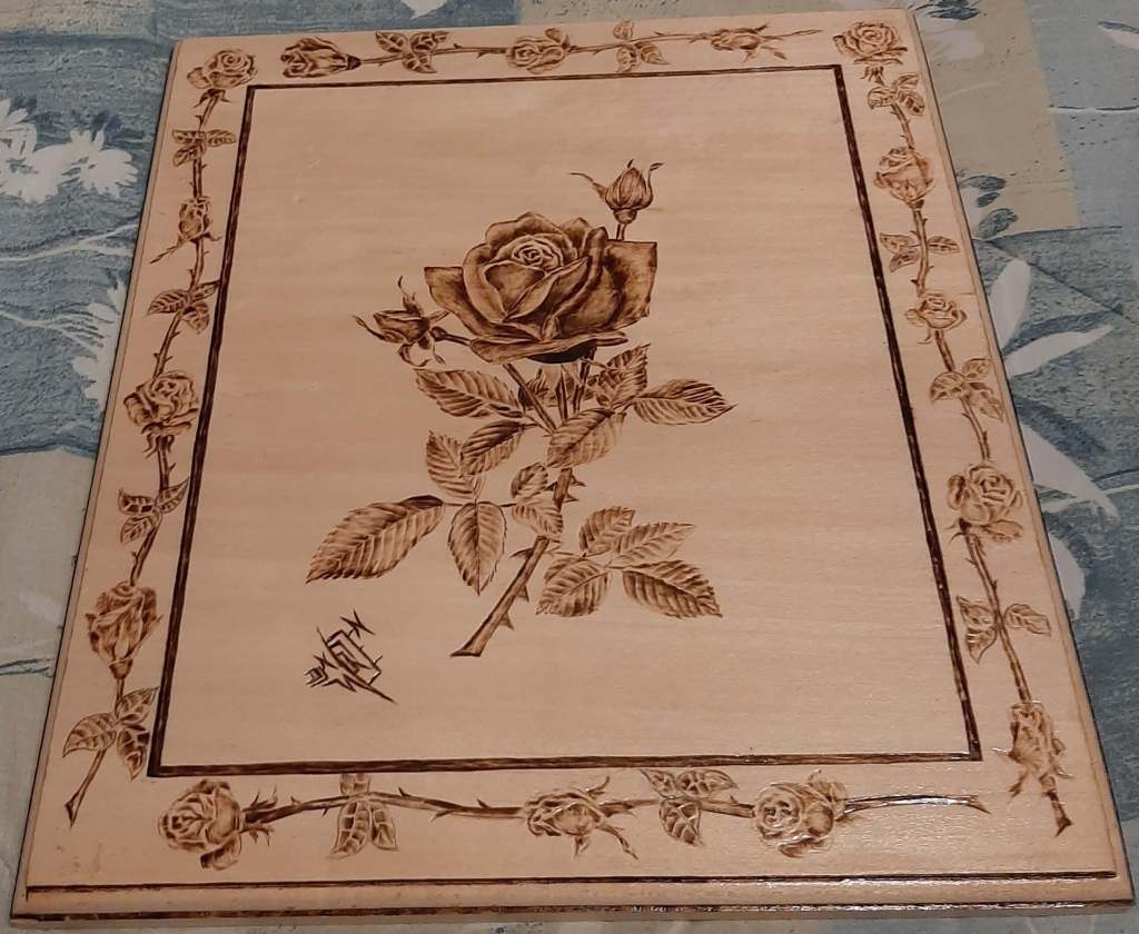Wood burning of a rose by Don Worden